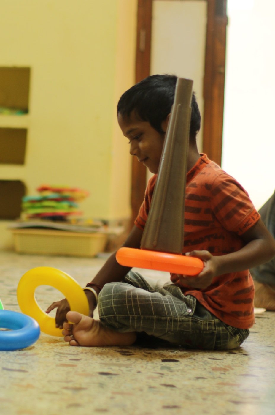 Child stacking colorful blocks